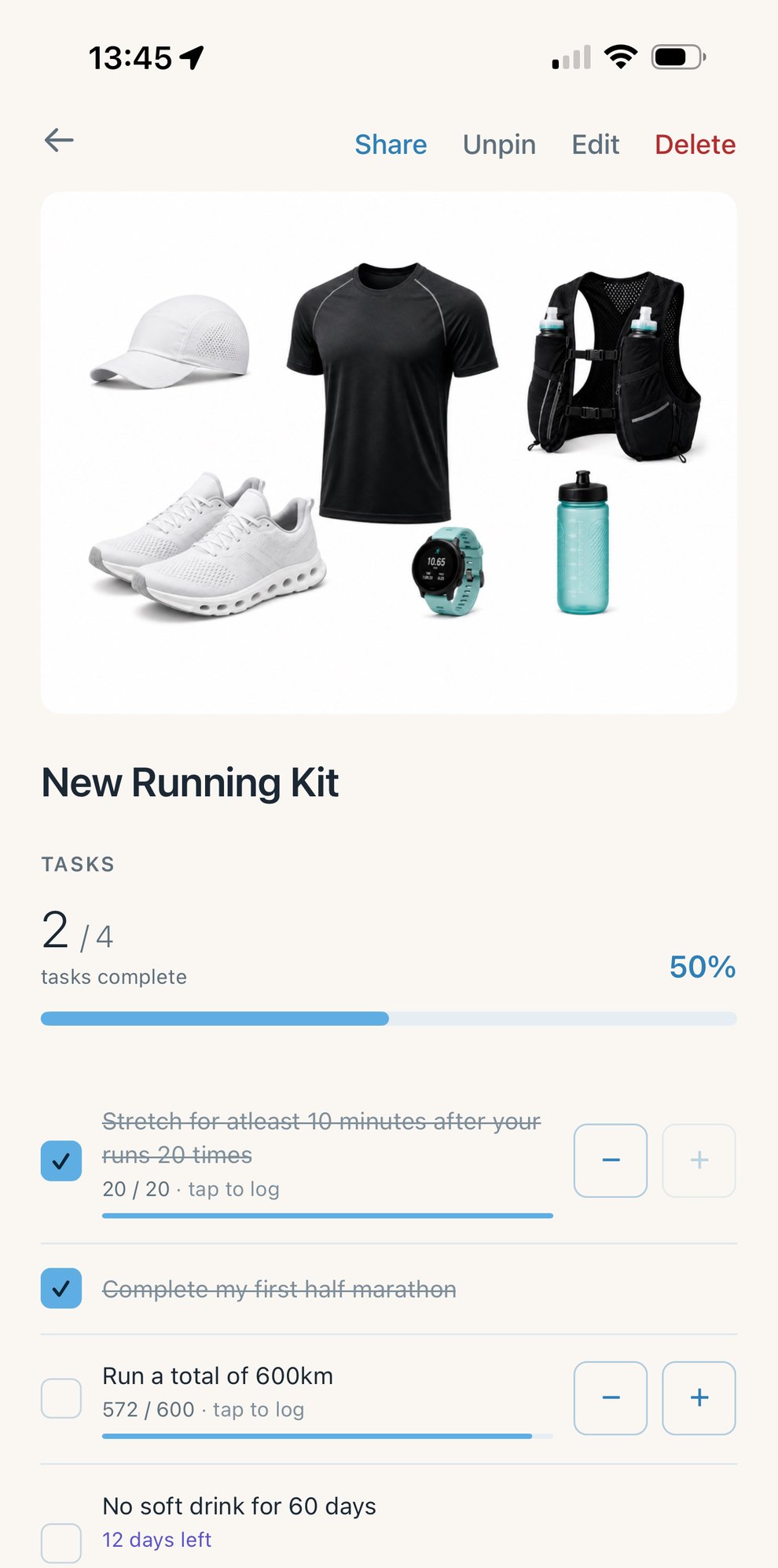 A live multi-task goal: new running kit, 572 of 600 km, abstain holding